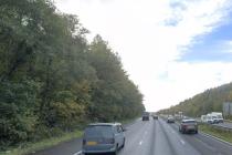 Street view picture of the M4 between Jct 34 and Jct 37 with trees in the area